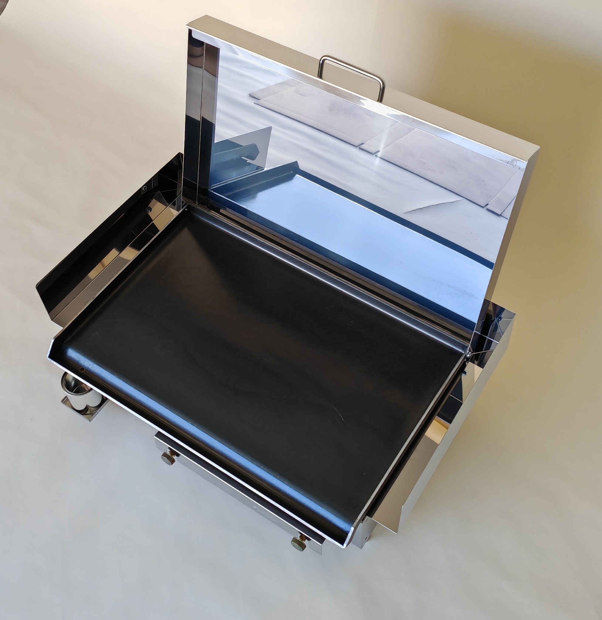 Furlan gas grill with a steel plate and high lid — premium outdoor cooking setup