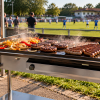Furlan P850 PRO gas flat top grill at a football club event with burgers and grilled meat